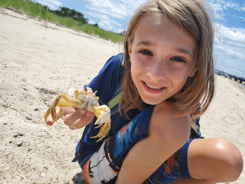 Child with Crab - Photography by Christi Leeson