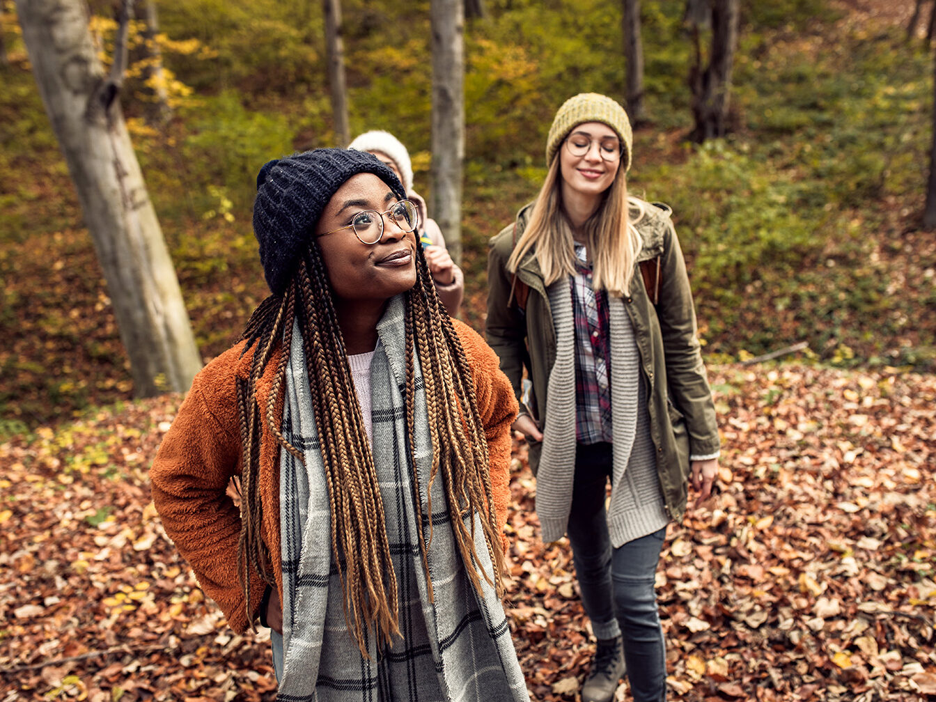 Three diverse women enjoying hiking outdoors
